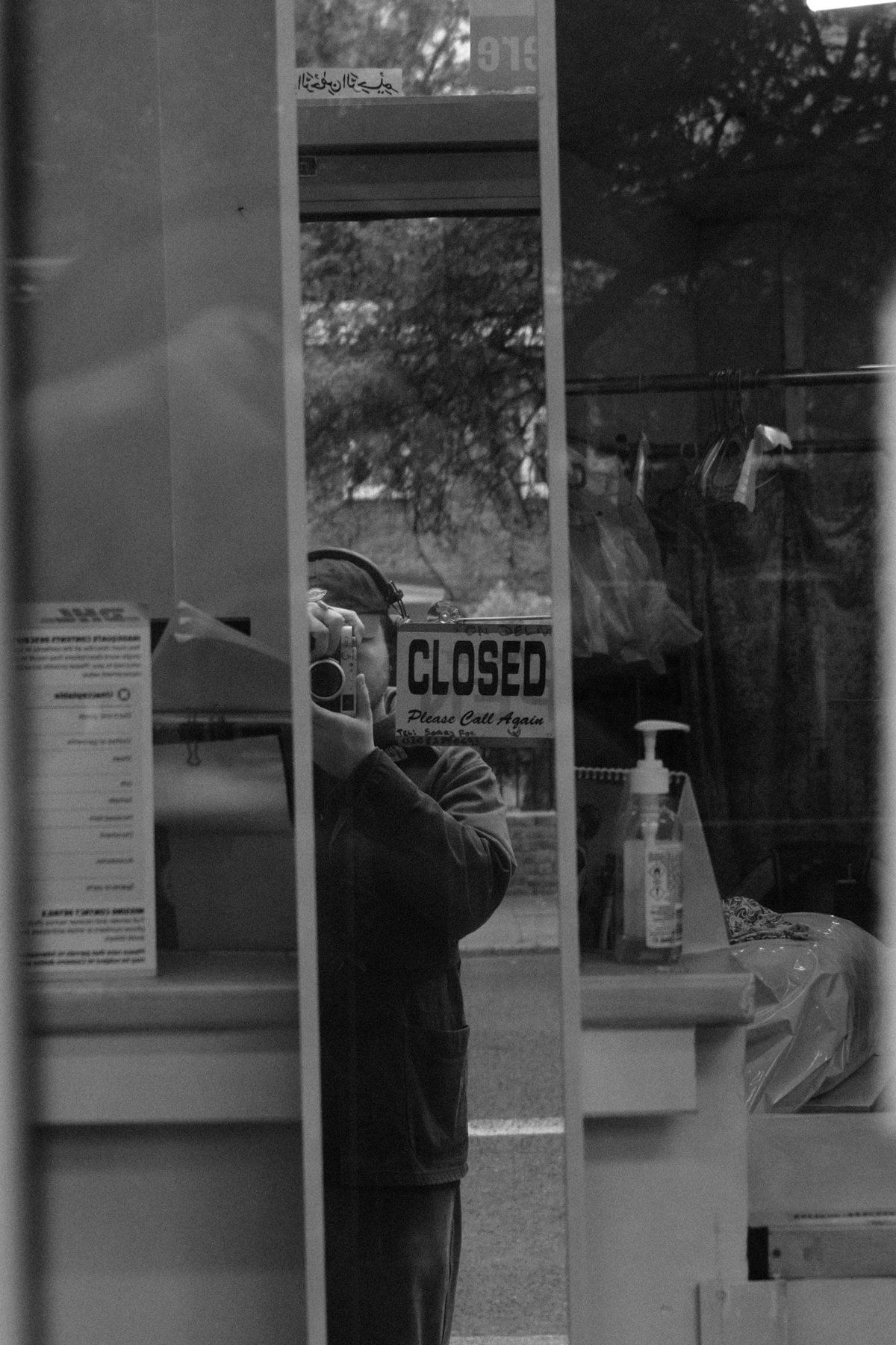 Oleksii Tkachenko, reflected in a shop window